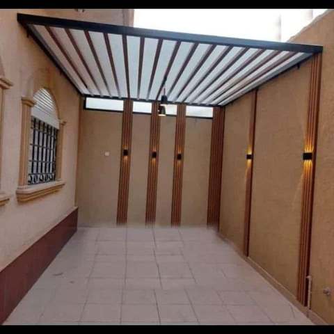 تنفيذ برجولة حديد وخشب خارجية
